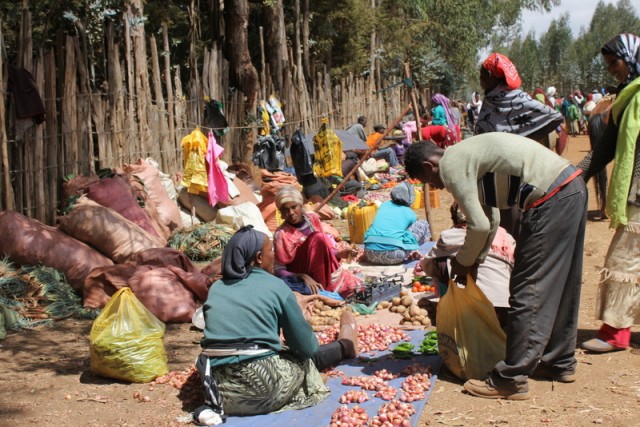 Buying and selling food at a market in Ethiopia