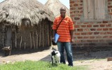 Researcher with goat in Uganda